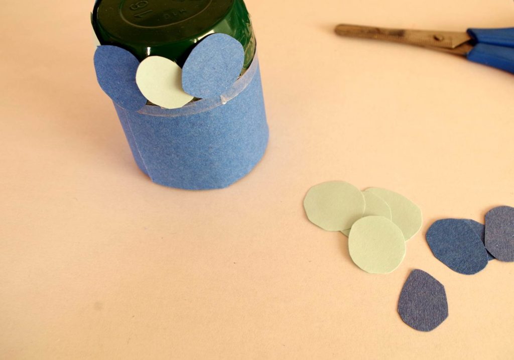 Decorate the yoghurt pot however you like. I chose different shades of blue paper in keeping with the colours of the sea.