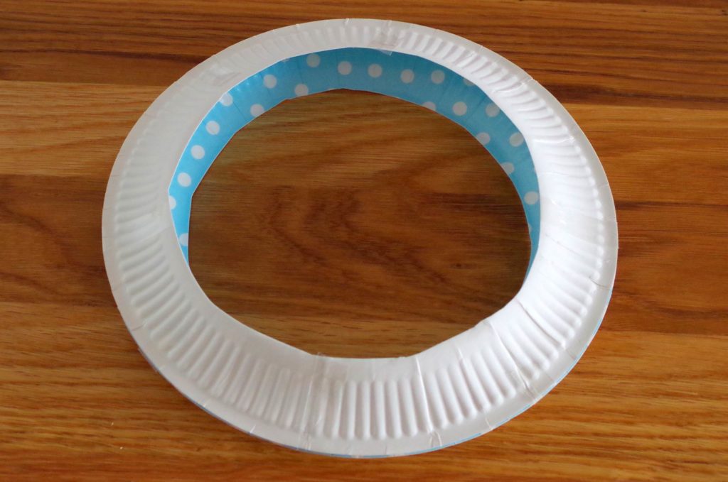 Two paper plates taped around the outside to make one ring.