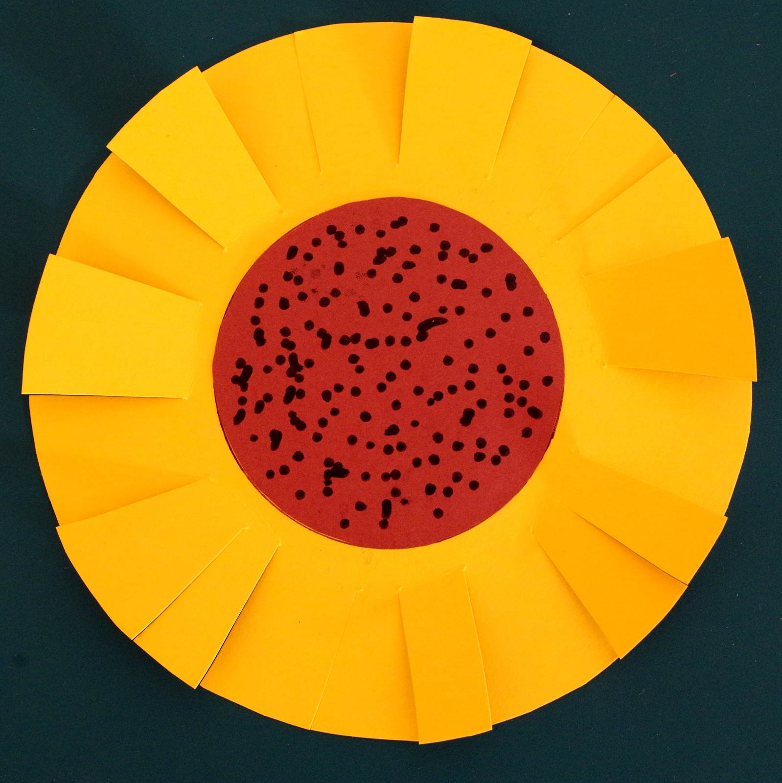 A sunflower cutting craft suitable for toddlers with an interest in using scissors.
