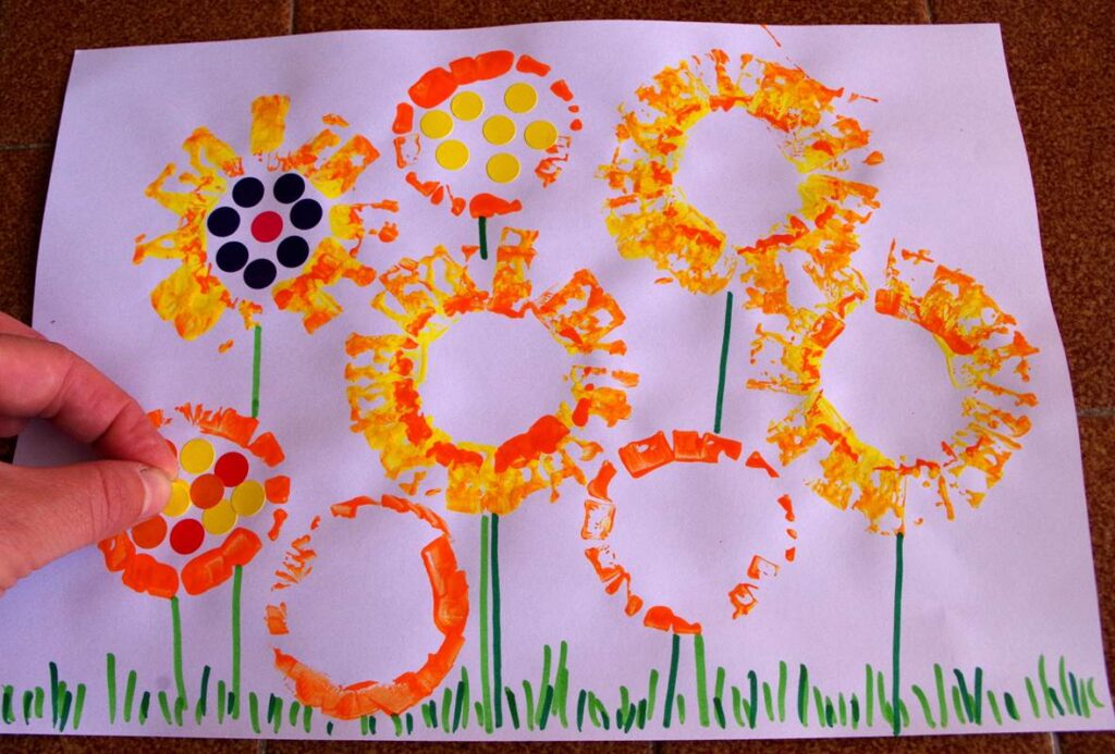 Orange and yellow flower garden made with flared tube prints.